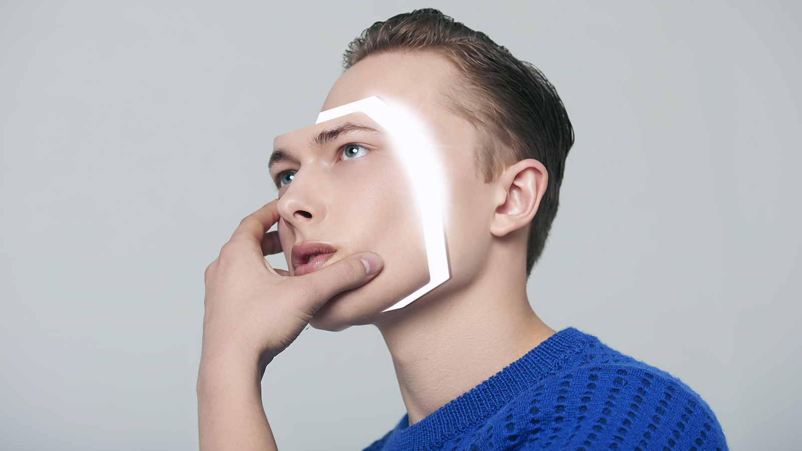 Android man removing his face
